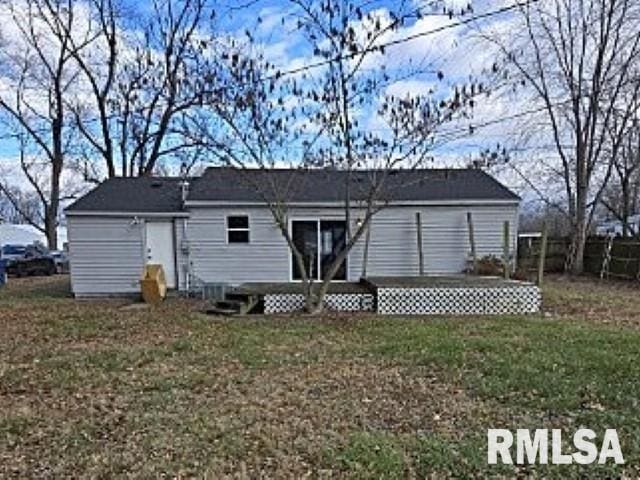 back of house with a yard