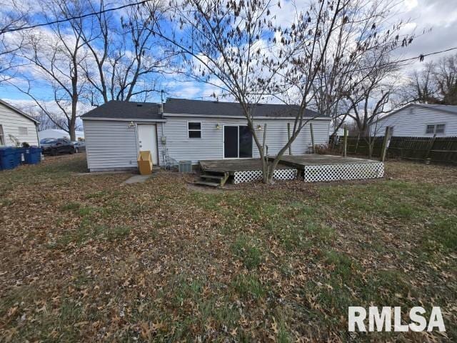 back of house with cooling unit and a wooden deck