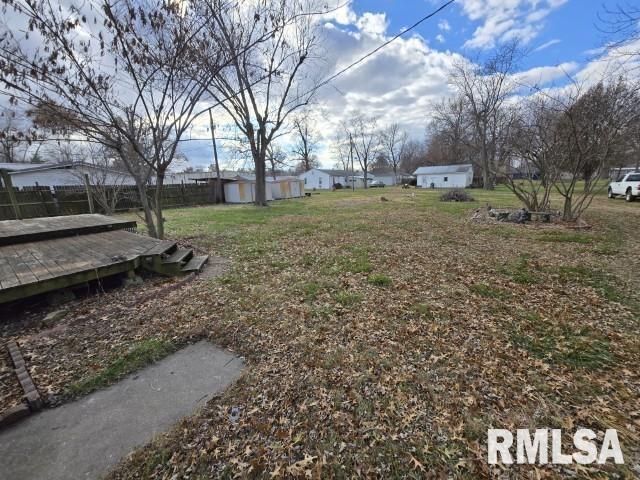 view of yard with a wooden deck