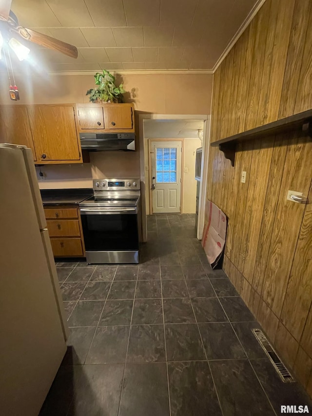 kitchen featuring stainless steel electric range oven, white fridge, range hood, and ornamental molding