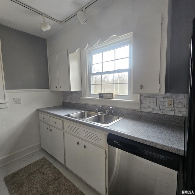 kitchen with white cabinets, dishwasher, sink, and rail lighting