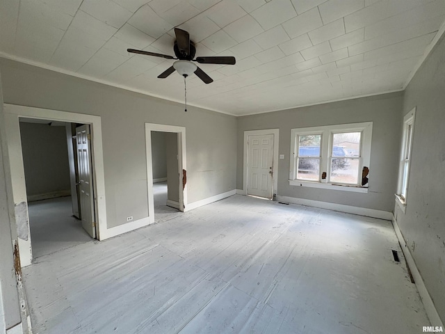 unfurnished room featuring ceiling fan, ornamental molding, and light hardwood / wood-style flooring