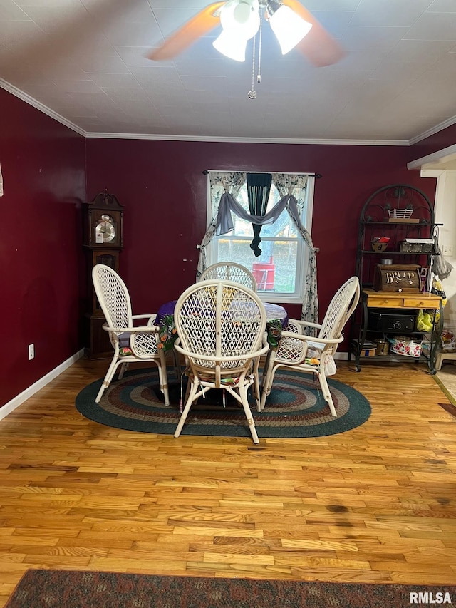 dining area with ceiling fan, light hardwood / wood-style floors, and ornamental molding