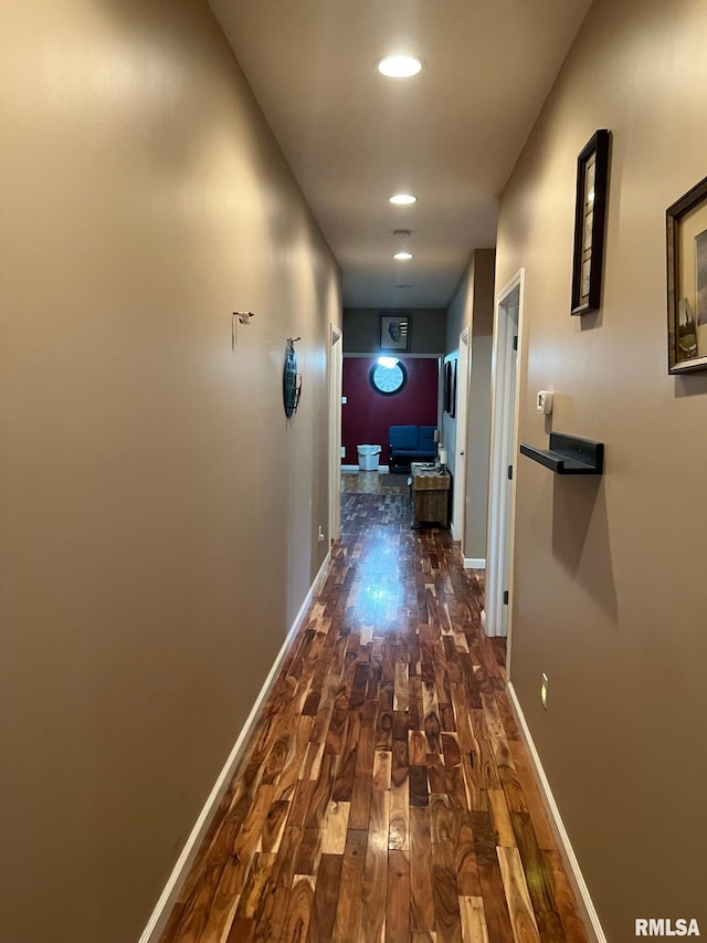 corridor with dark hardwood / wood-style floors