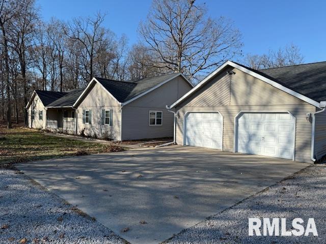 14892 Fowler School Rd, Marion, IL 62959 - view of home's exterior with concrete driveway and an attached garage