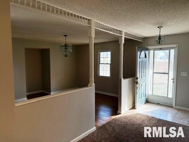14892 Fowler School Rd, Marion, IL 62959 - entrance foyer featuring a textured ceiling and a chandelier