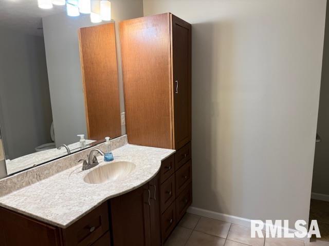 14892 Fowler School Rd, Marion, IL 62959 - bathroom featuring vanity and tile patterned floors