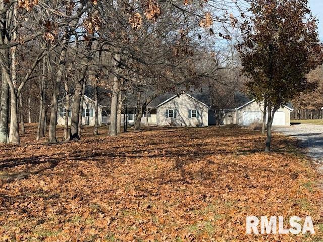 14892 Fowler School Rd, Marion, IL 62959 - view of front facade with a garage and gravel driveway