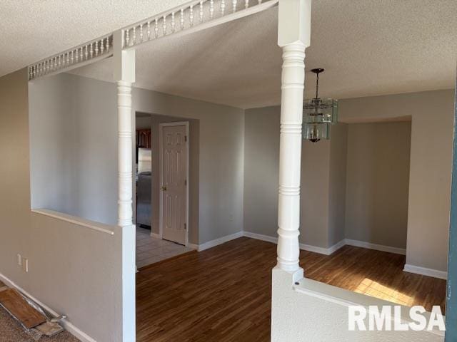 14892 Fowler School Rd, Marion, IL 62959 - hallway with wood finished floors and a textured ceiling