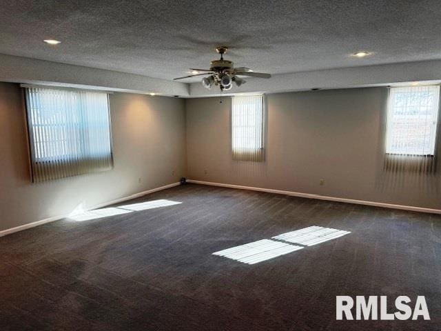 14892 Fowler School Rd, Marion, IL 62959 - spare room featuring carpet, a ceiling fan, and a textured ceiling