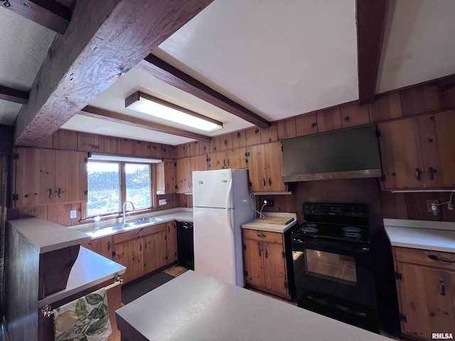 kitchen with wood walls, sink, beamed ceiling, and black appliances