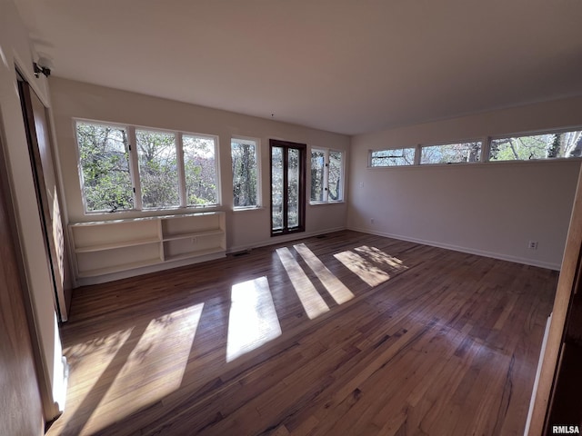 unfurnished room featuring dark hardwood / wood-style floors