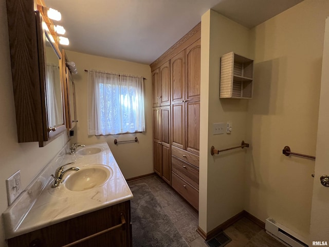 bathroom featuring tile patterned flooring, vanity, and a baseboard radiator