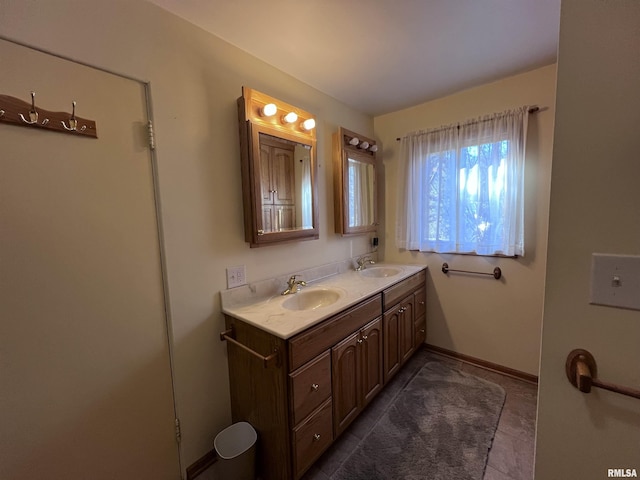 bathroom featuring tile patterned floors and vanity