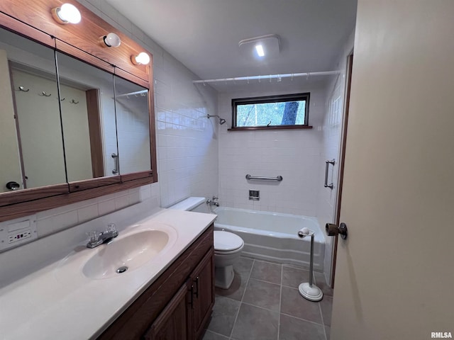 full bathroom with vanity, tiled shower / bath, tile patterned flooring, decorative backsplash, and toilet