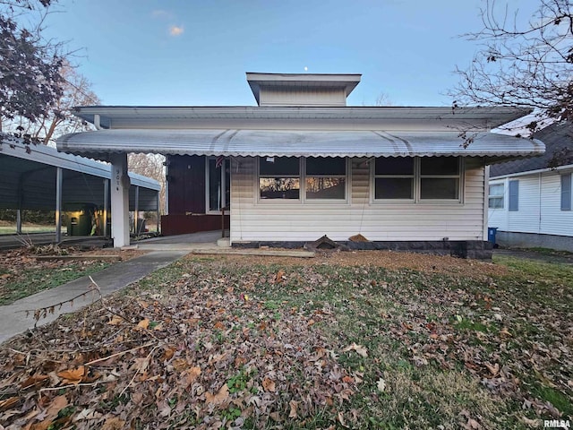 view of front of property with a carport