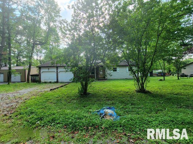 view of yard with a garage