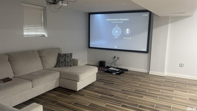 cinema room with dark hardwood / wood-style flooring