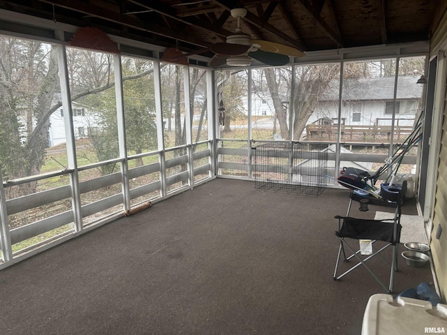 unfurnished sunroom with lofted ceiling