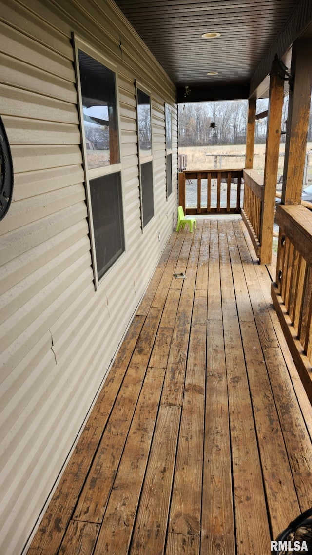 wooden terrace with a porch