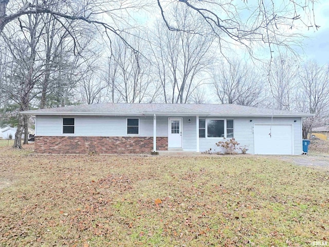 ranch-style home with a garage and a front lawn