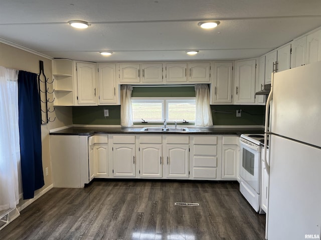 kitchen with white cabinets, dark hardwood / wood-style floors, white appliances, and sink