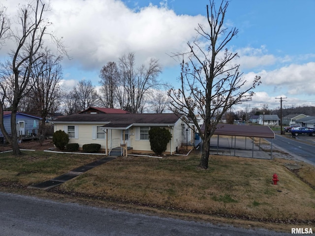 single story home featuring a carport and a front yard