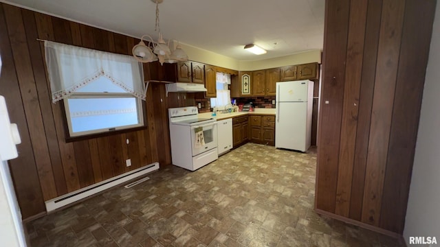 kitchen with decorative backsplash, white appliances, a baseboard radiator, a notable chandelier, and wood walls