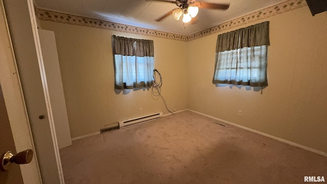 unfurnished room with carpet, ceiling fan, a healthy amount of sunlight, and a baseboard radiator