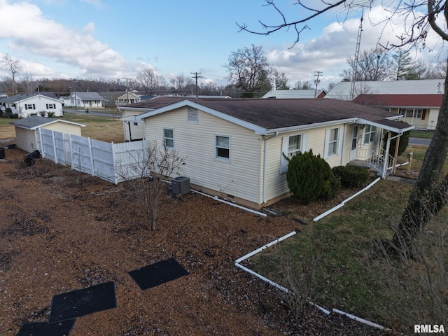 view of side of home with cooling unit