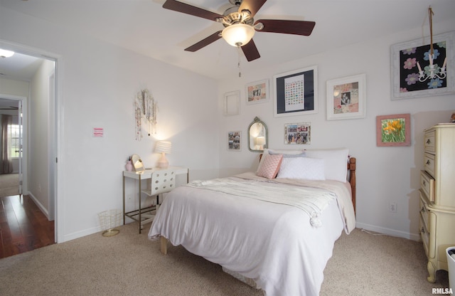 bedroom with hardwood / wood-style floors and ceiling fan