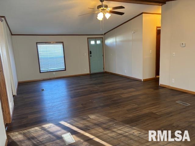 unfurnished room with ceiling fan, dark hardwood / wood-style flooring, crown molding, and vaulted ceiling