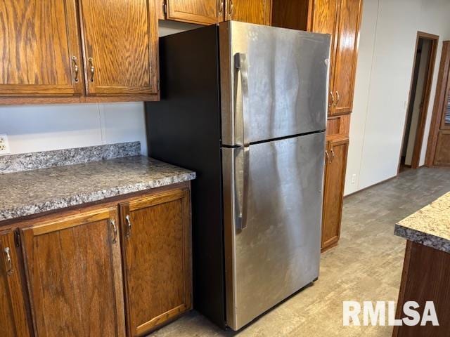 kitchen featuring stainless steel refrigerator