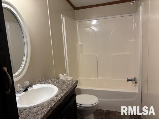 full bathroom featuring tile patterned floors, shower / bathing tub combination, toilet, vanity, and ornamental molding