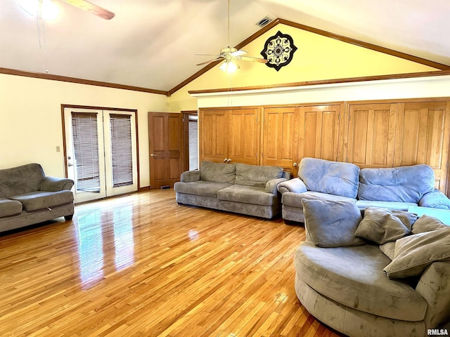 living room featuring ceiling fan, light hardwood / wood-style floors, crown molding, and high vaulted ceiling