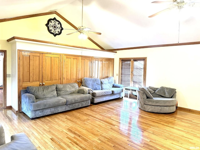 living room featuring ceiling fan, light wood-type flooring, and high vaulted ceiling