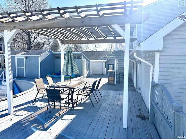 deck featuring a storage unit and a pergola