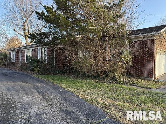 view of property exterior featuring a garage