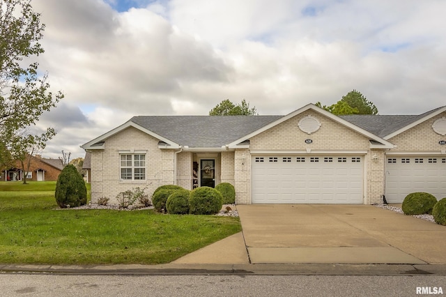 ranch-style home featuring a front yard and a garage