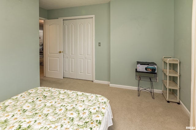 carpeted bedroom with a closet