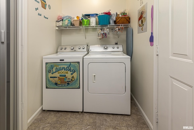 laundry room featuring washing machine and clothes dryer