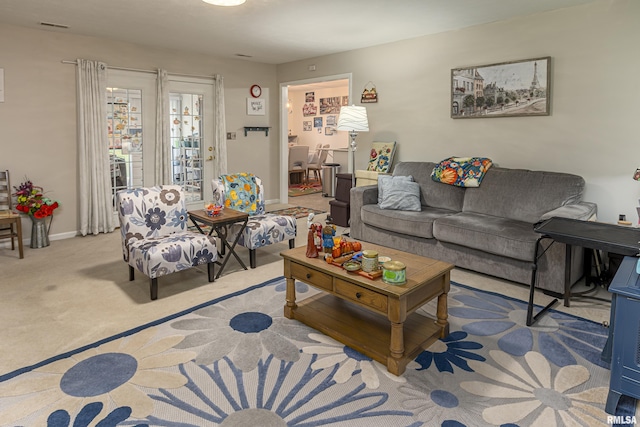 living room featuring light colored carpet