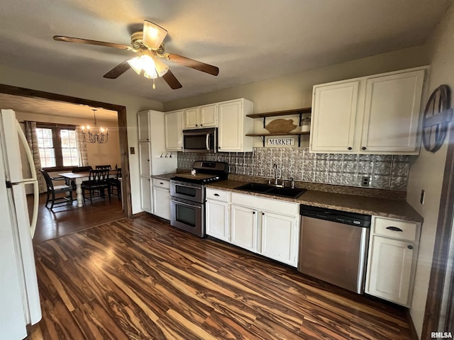 kitchen featuring white cabinetry, sink, dark hardwood / wood-style floors, ceiling fan with notable chandelier, and appliances with stainless steel finishes