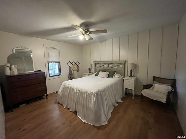 bedroom featuring ceiling fan and dark hardwood / wood-style flooring