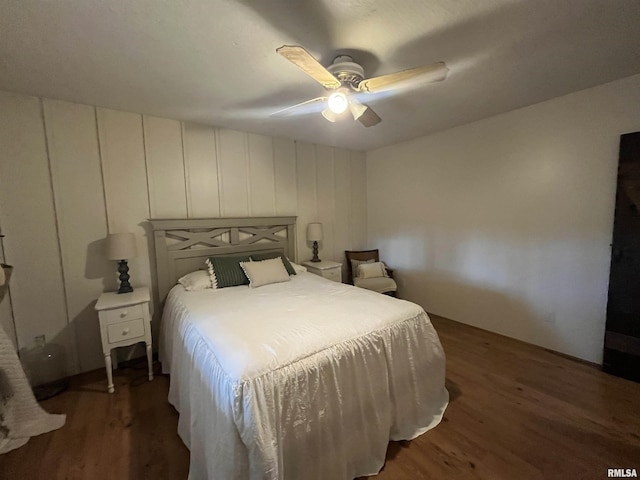 bedroom featuring ceiling fan and dark hardwood / wood-style flooring