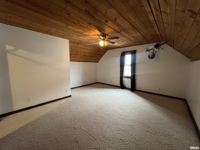 additional living space with light carpet, vaulted ceiling, ceiling fan, and wooden ceiling