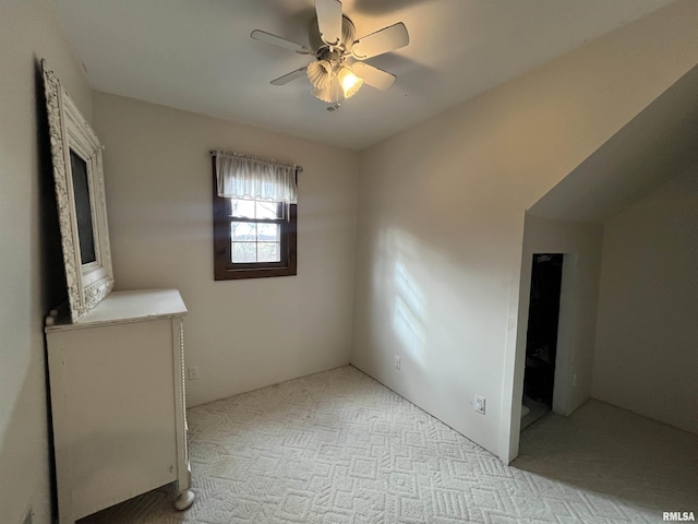 interior space with ceiling fan