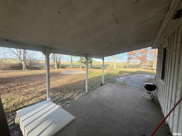 view of patio with a rural view