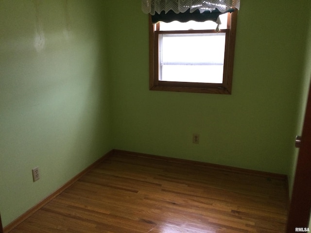 empty room featuring hardwood / wood-style floors