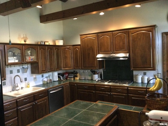 kitchen with appliances with stainless steel finishes, sink, dark brown cabinets, tile countertops, and beam ceiling